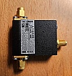>26GHz Bias Tee. Picosecond Pulse Labs model: 5541A. Bias tee port is female SMA interface, RF and common ports are male SMA connectors.