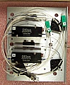 Combo of dual Dicon 1x1 switch and one AFOP 1x2 3dB coupler. For 1.55um. Mounted on Aluminum plate. 'Sell As Is'. Without test data
