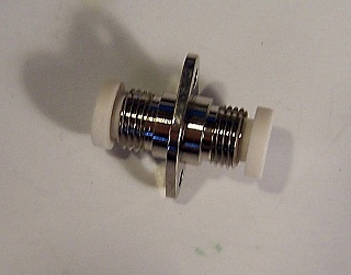 Fiber oval adapter, FC/PC to FC/PC, Key width is about 2.24mm. Zirconia internal split sleeve. Senko P/N: 298-104