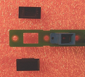 Cover for panel hole (cutout) of simplex SC or duplex LC adapter. Snap in type.