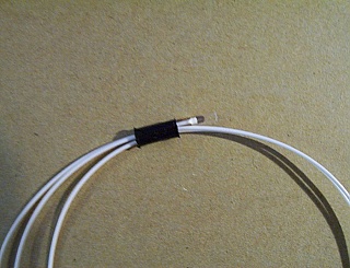 Fiber-tube-assmbly. FC/APC connector at one end, 2.23mm-diameter 12-degree angled tube/ferrule at the other end,  69-cm long 900um-buffered MM fiber, P/N: J-FAFA-6-003-J1