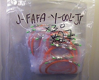 Flexcore-1060 fiber (ultra-low bending loss). FC/APC - FC/PC 2-meter  900um-buffered simplex SMF jumper for 980nm fiber optics. P/N: J-FAFP-Y-2-JT