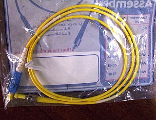 ST/UPC-SC/UPC 1-meter SMF simplex jumper, made by FIS