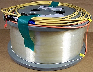 15.999km Lucent/AT&T dispersion-shifted fiber (DS,DSF) spool. With zero dispersion around 1550nm. With actual dispersion test data. With 2 FC/PC fiber connectors. Fiber ID number ending with 'DCB'.