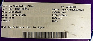 Near 100-meter 1310nm PM bare Fiber. Corning specialty fiber type: PM 1310/400. P/N: 035613000. Designed for 1.3um, but also used for 1.55um.