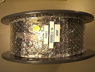 ~160-meter Fujikura PM bare Fiber, SM.98-P-6/125-UV/UV-250(200KPSI). designed for 980nm. Test sheet photo is from sold spool only.
