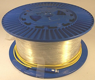 10.56km SMF-28 bare fiber spool, with one SC/PC connector. Internal fiber end is not accessible