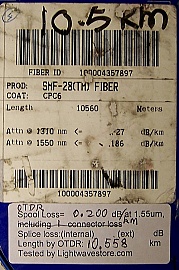 10.56km SMF-28 bare fiber spool, with one SC/PC connector. Internal fiber end is not accessible