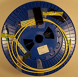 25.26km SMF-28 bare fiber spool, with 2 FC/APC connectors in 3mm cable. Loss is higher than new version, but still meets old specification.
