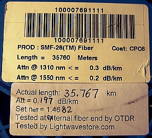 35.76km SMF-28 bare fiber spool. Internal fiber end is not accessible. with one SC/PC connector at external end.