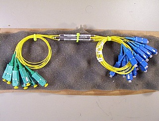 50% 1x2 coupler at 1550nm +/-40nm, model: K12A15C50SJ902CS. With 1 SC/APC and 2 SC/PC connectors.