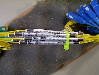 50% 1x2 coupler at 1550nm +/-40nm, model: K12A15C50SJ902CS. With 1 SC/APC and 2 SC/PC connectors.