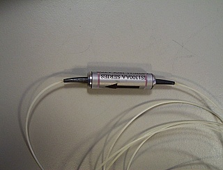 1.3um fiber isolator with FC/PC connectors. JDS model: IS1300AA-FP. We will verify it is for 1.3um before shipping