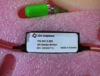 1x2 JDSU latching Switch with 3 FC/APC fiber connectors, 1.3/1.55um. JDS P/N: SN12-Z50.
