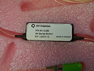 1x2 JDSU latching Switch with 3 FC/APC fiber connectors, 1.3/1.55um. JDS P/N: SN12-Z50. With RMA label on the product box