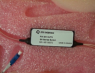 1x2 JDSU latching Switch with 3 LC/PC fiber connectors. For 1.3um and probably also for 1.55um. JDS P/N: SN12-Z74.