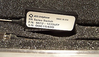 1x2 JDSU latching Switch with 3 FC/PC connectors, 1290-1330nm and 1525-1575nm. JDS P/N: SN12+107DUFP.