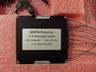 1x8 LT800-series switch module, single-mode fiber, 1.55um wavelength. With BSC II/UPC connectors. LIGHTech P/N: N108LRST-SSS9.