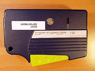 Fiber connector cleaner, by OPTIPOP, one slot.  Seems with 1/3 unused reel