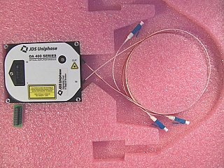 OA 400 C-band series mini EDFA module,  fixed gain, 16dBm saturated output. JDS model: OAA-16U04G2CB. P/N: 21055036. With test data
