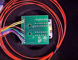 15xxnm 14-pin butterfly laser module with PCB board and electrical ribbon cable/connector. We do not know the model number, wavelength, output power
