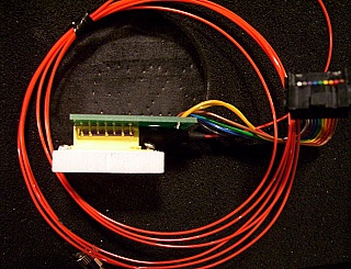 15xxnm 14-pin butterfly laser module with PCB board and electrical ribbon cable/connector. We do not know the model number, wavelength, output power