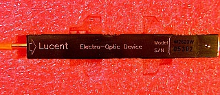 Combo of 10Gb dual-drive intensity modulator module and 10mW 1531.11nm PMF laser module (Lucent modulator model: M2623W, Lucent laser model: D2584P58). There is fiber between modulator and laser modules.
