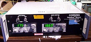 Corning fiber amplifier demonstrator,  >14dBm flat over C-band at 4dBm input. With ILX 200mA laser driver ($650) and 2A Temperature controller ($630) instruments, and EDFA module ($450).