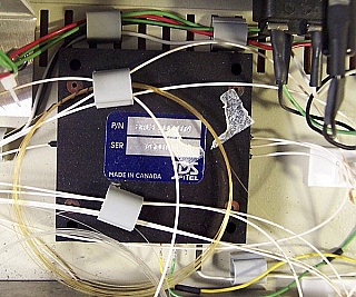 JDS benchtop stabilized 1299.7nm/1549nm laser source, FC/PC adapter,  FP laser with multimode lasing.
